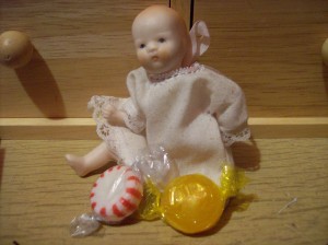 porcelain baby doll with hard candy