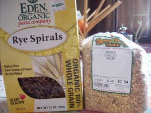 box of rye spiral pasta and bag of whole grain barley