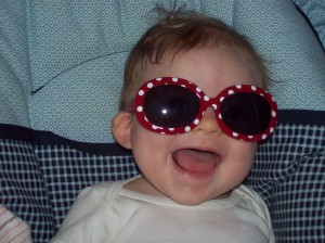 baby with red and white polka dot sunglasses