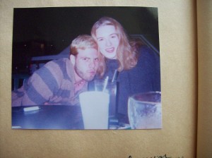 young couple outside coffee house 